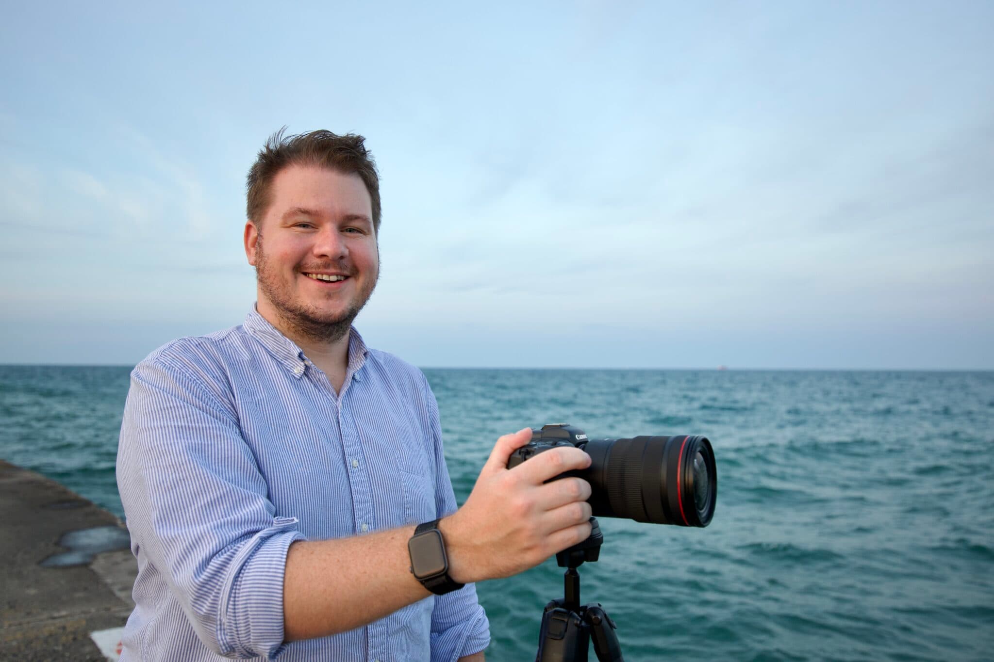 Andy Feliciotti with camera near the water in Chicago