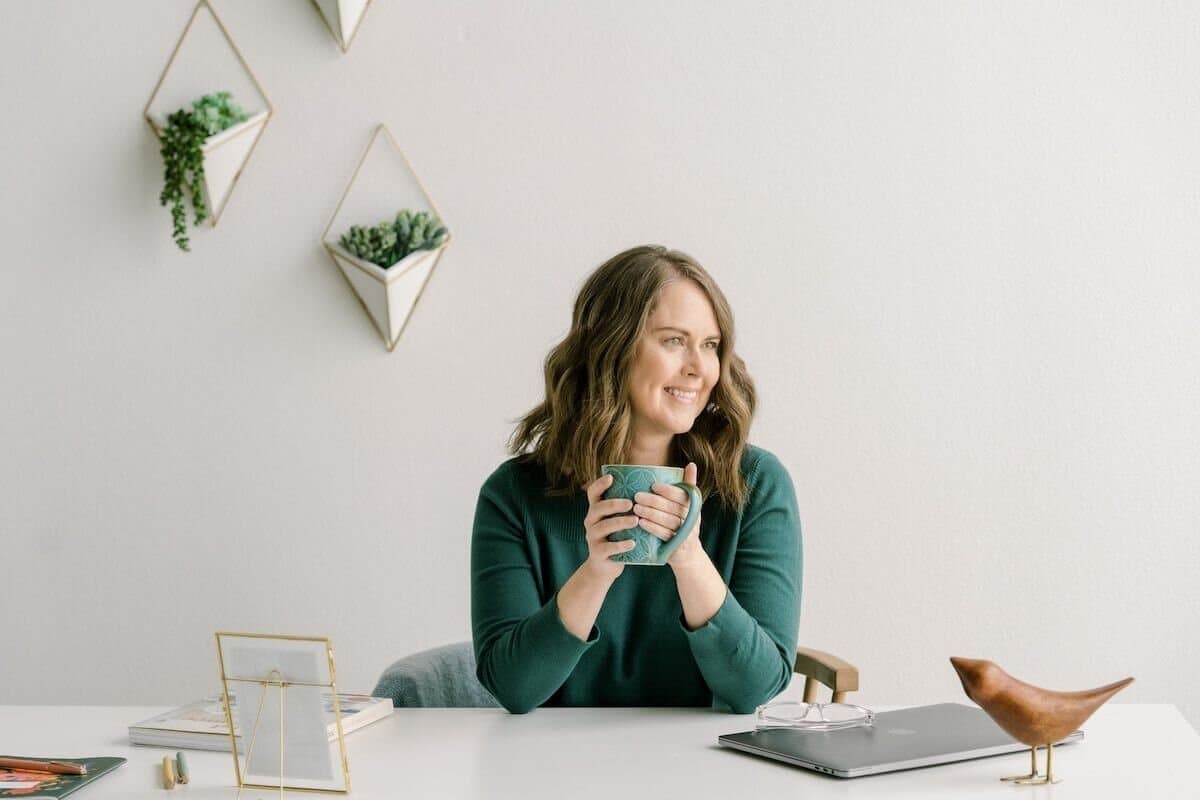 christy price head shot image with coffee mug